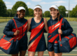 Australian netball uniforms on three female netball players wearing custom hats.