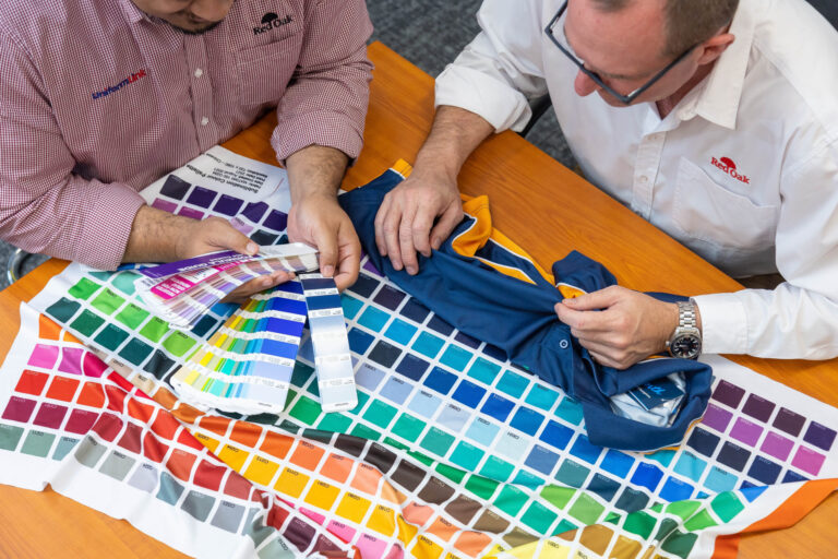 Uniform Link team looking at fabric types and sublimated colours Uniform Link team looking at fabric types and sublimation colours